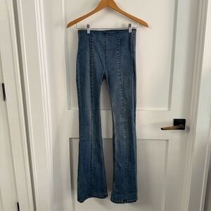 High waist pull on Blue wash Flared Women Jeans with front seaming detail